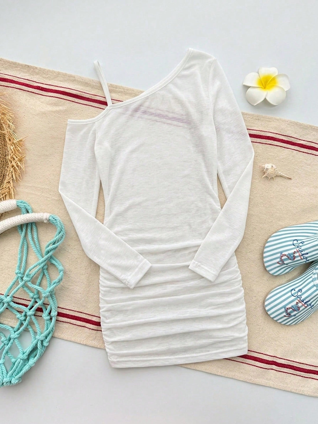 Girls plus size one-piece swimsuit in white with striped pattern, asymmetric neckline, long sleeves, fitted shape, and skirt-style bottom.