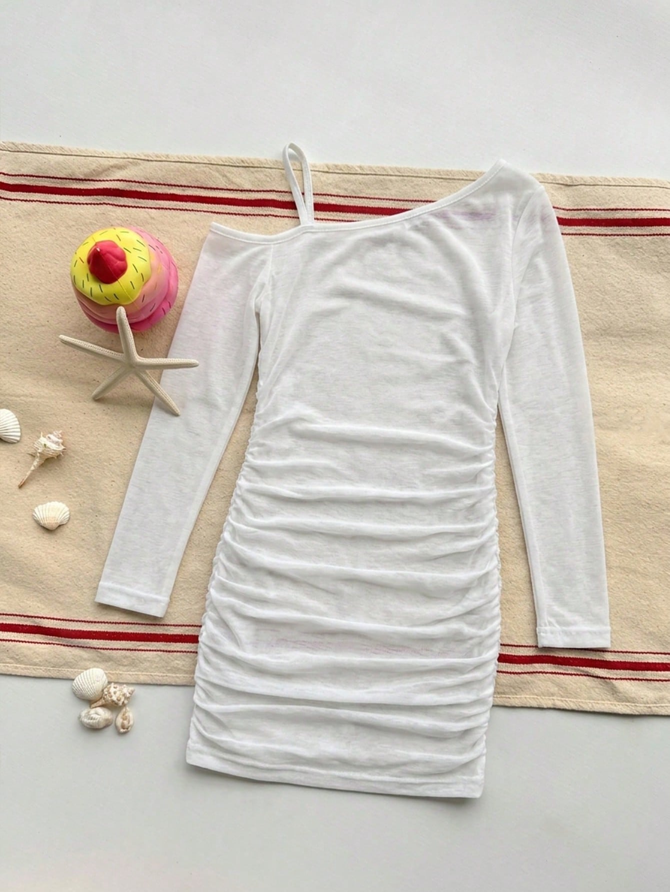 Girls plus size one-piece swimsuit in white with striped pattern, asymmetric neckline, long sleeves, fitted shape, and skirt-style bottom.