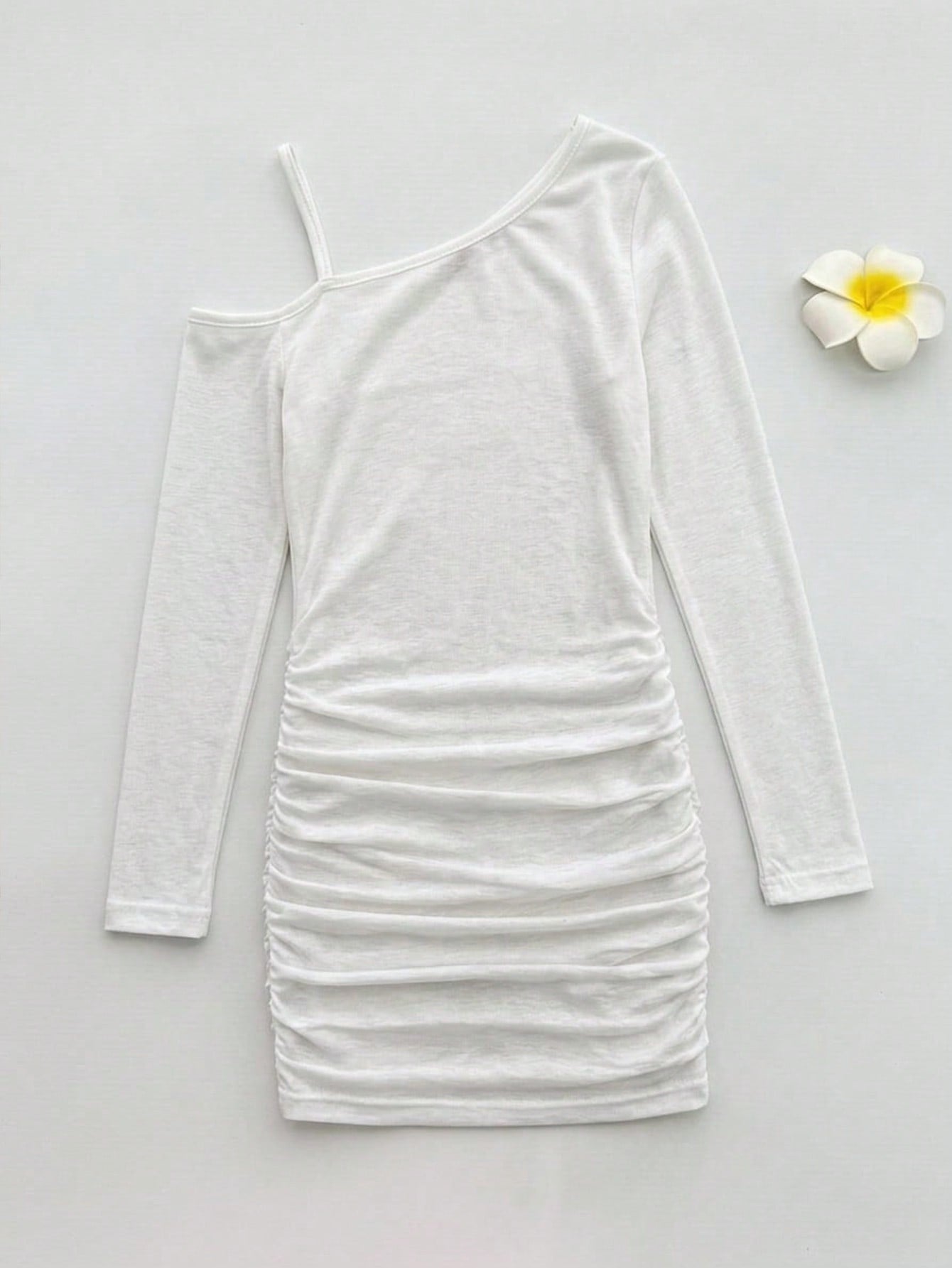 Girls plus size one-piece swimsuit in white with striped pattern, asymmetric neckline, long sleeves, fitted shape, and skirt-style bottom.