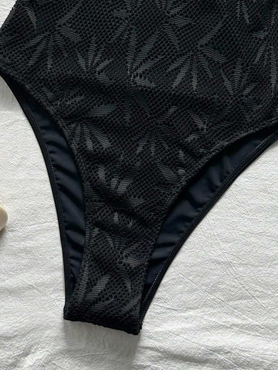 Women's solid color one-piece swimsuit featuring a backless scoop neck design and high cut fit