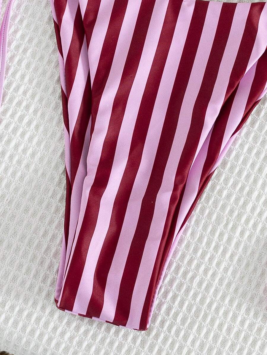 Multicolor striped halter neck two-piece bikini set featuring wireless triangle cups and low-waist tie-side bottoms.