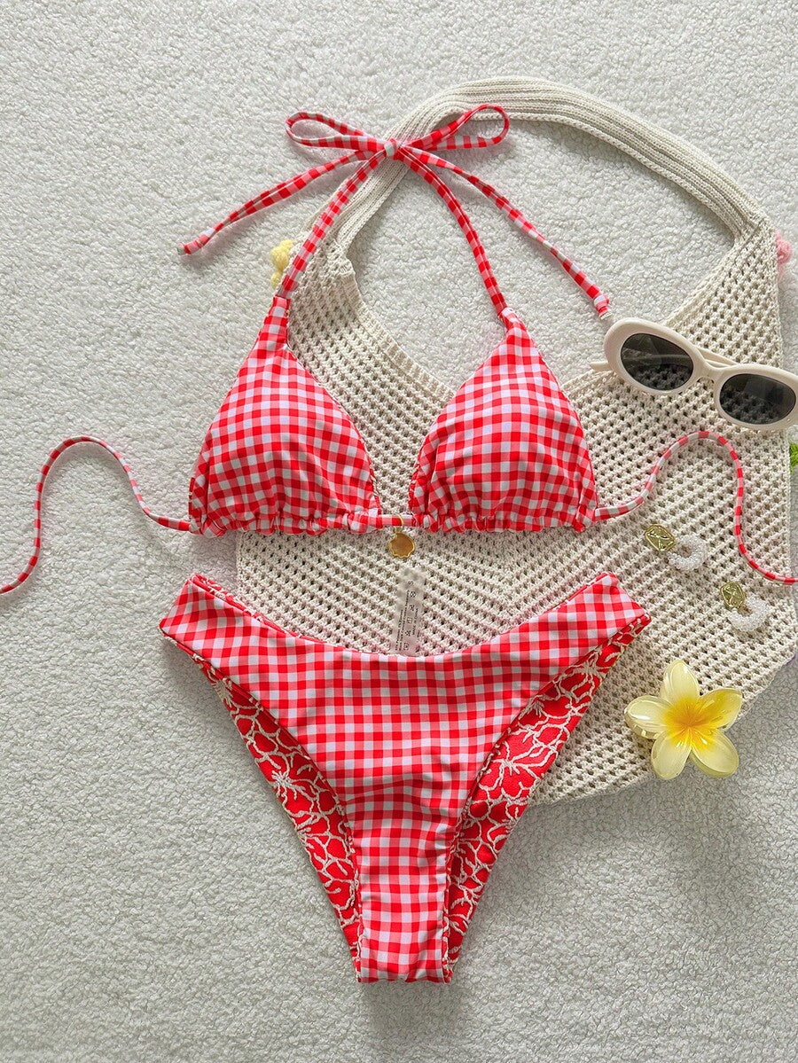 Women's black textured plaid 2-piece bikini set featuring a halter neckline, wireless triangle cups with removable padding, and mid-waist bottoms.