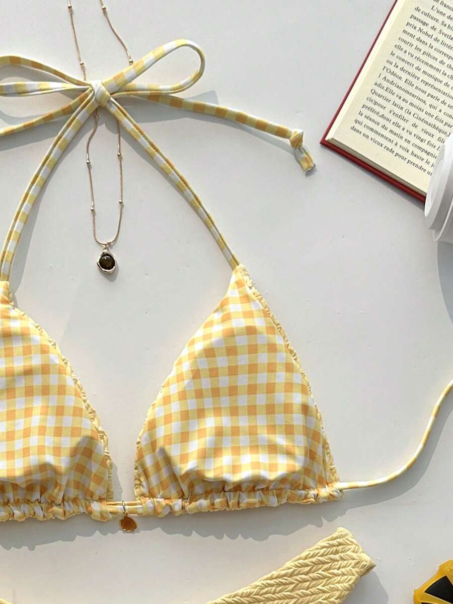 Women's black textured plaid 2-piece bikini set featuring a halter neckline, wireless triangle cups with removable padding, and mid-waist bottoms.