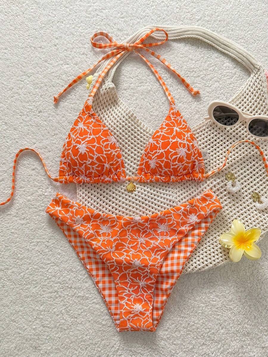 Women's black textured plaid 2-piece bikini set featuring a halter neckline, wireless triangle cups with removable padding, and mid-waist bottoms.