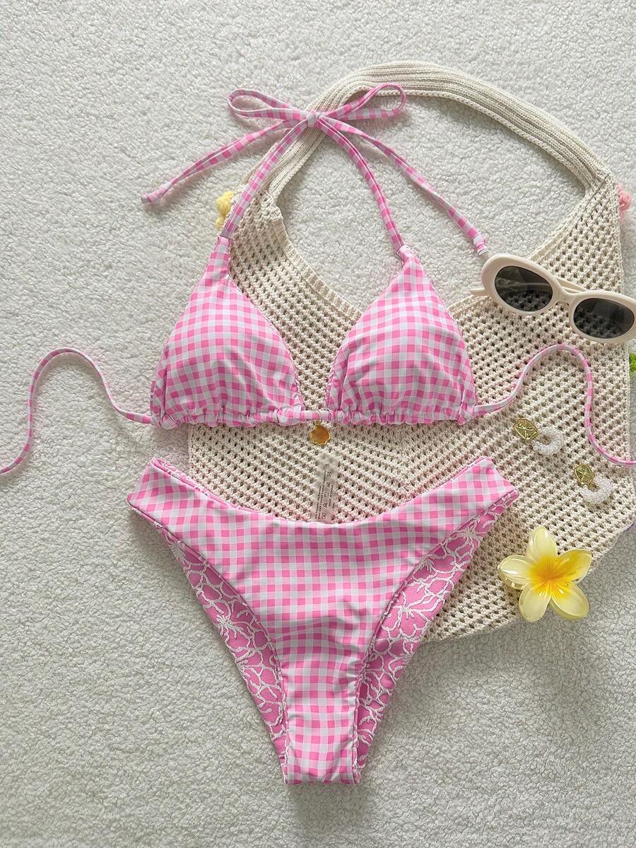 Women's black textured plaid 2-piece bikini set featuring a halter neckline, wireless triangle cups with removable padding, and mid-waist bottoms.