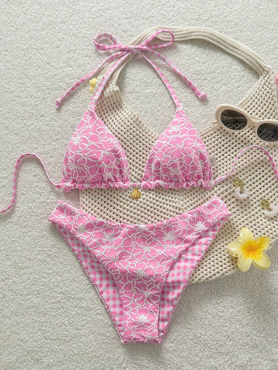 Women's black textured plaid 2-piece bikini set featuring a halter neckline, wireless triangle cups with removable padding, and mid-waist bottoms.