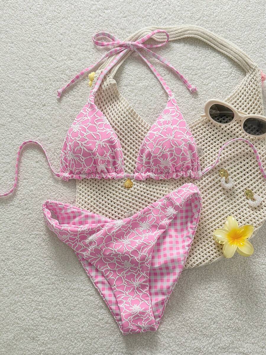 Women's black textured plaid 2-piece bikini set featuring a halter neckline, wireless triangle cups with removable padding, and mid-waist bottoms.