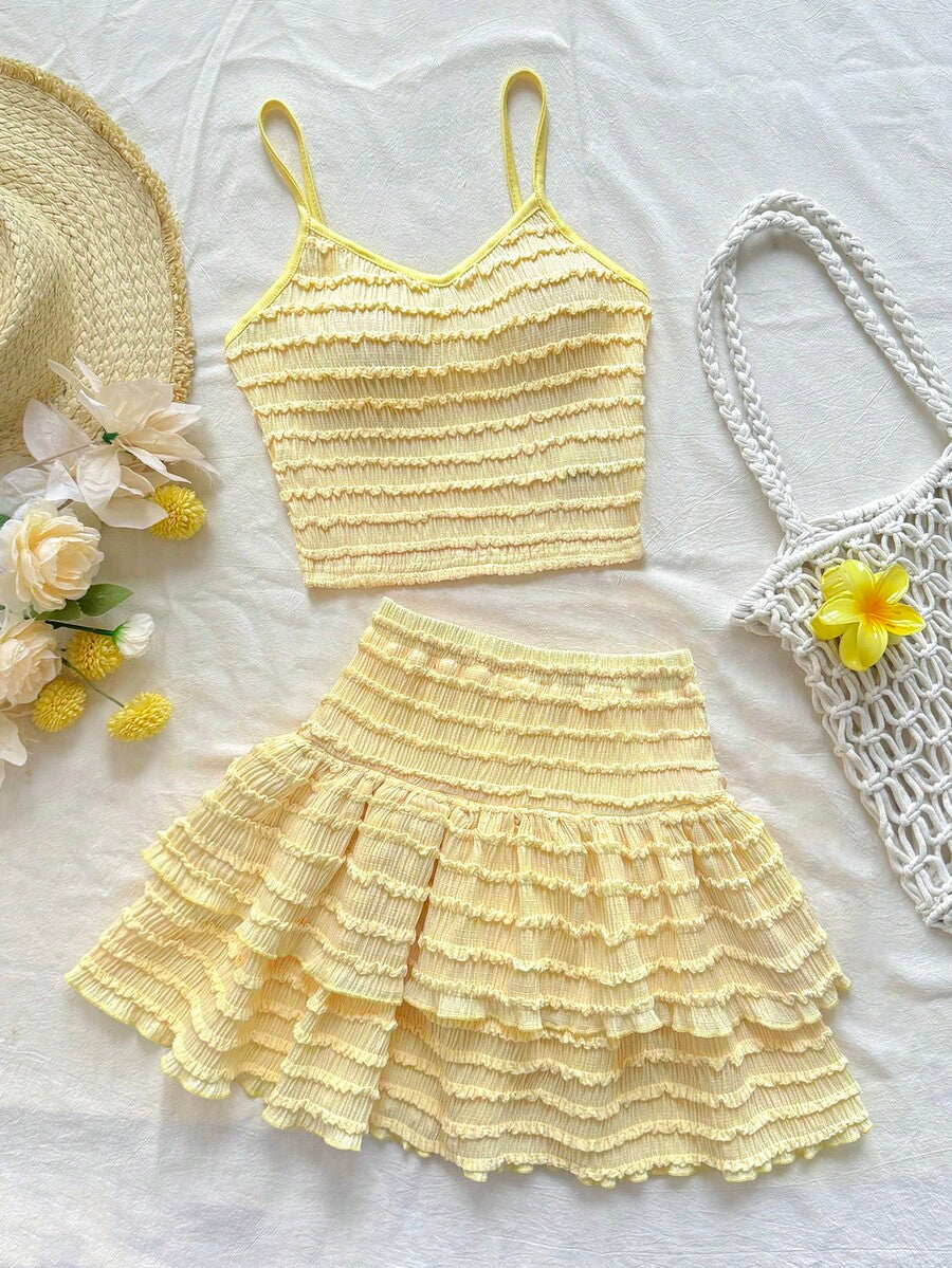 Tween girls solid color two-piece vacation outfit featuring a spaghetti strap camisole short top and a tiered skirt in soft knitted fabric.