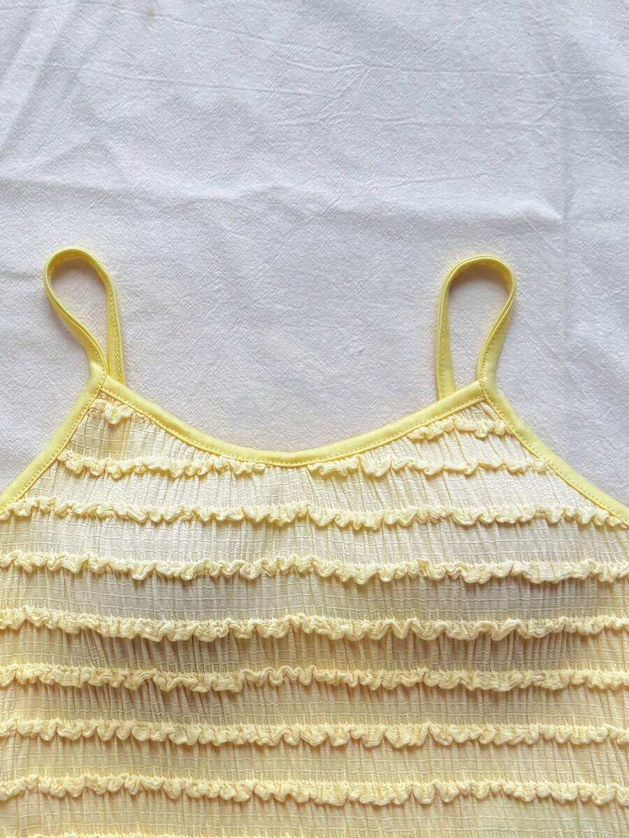 Tween girls solid color two-piece vacation outfit featuring a spaghetti strap camisole short top and a tiered skirt in soft knitted fabric.