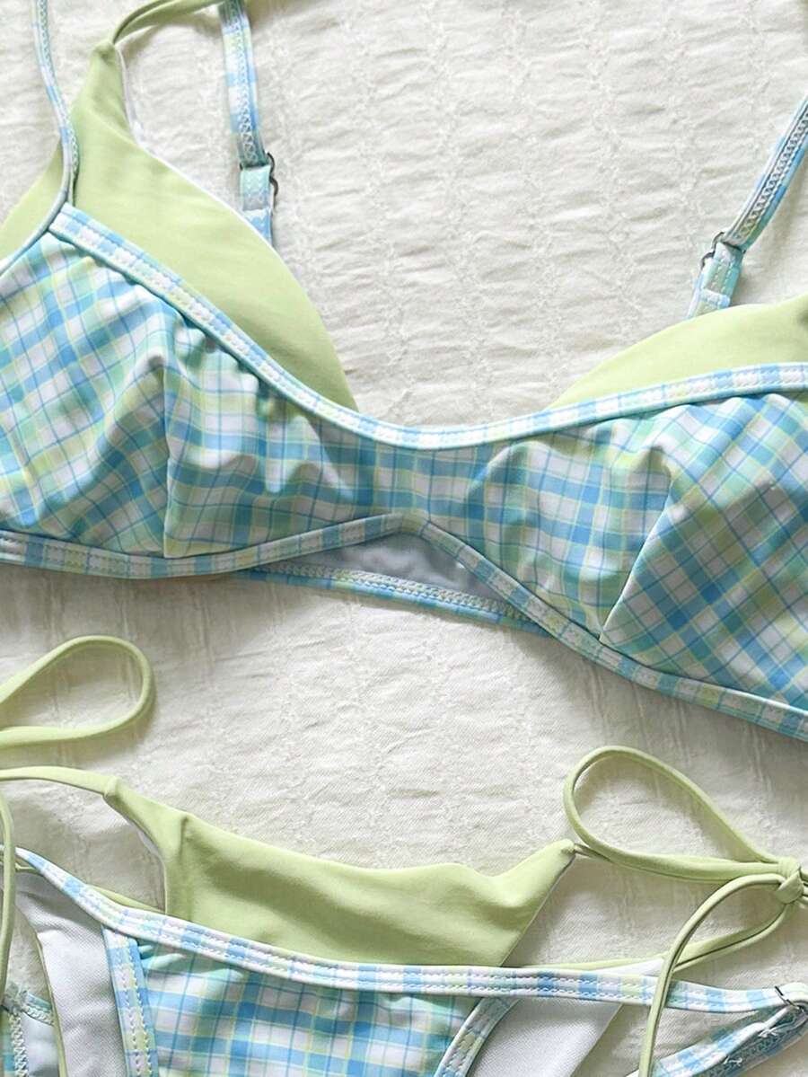 Women's retro polka dot high waist bikini swimsuit set with spaghetti straps and knot tie-back top.