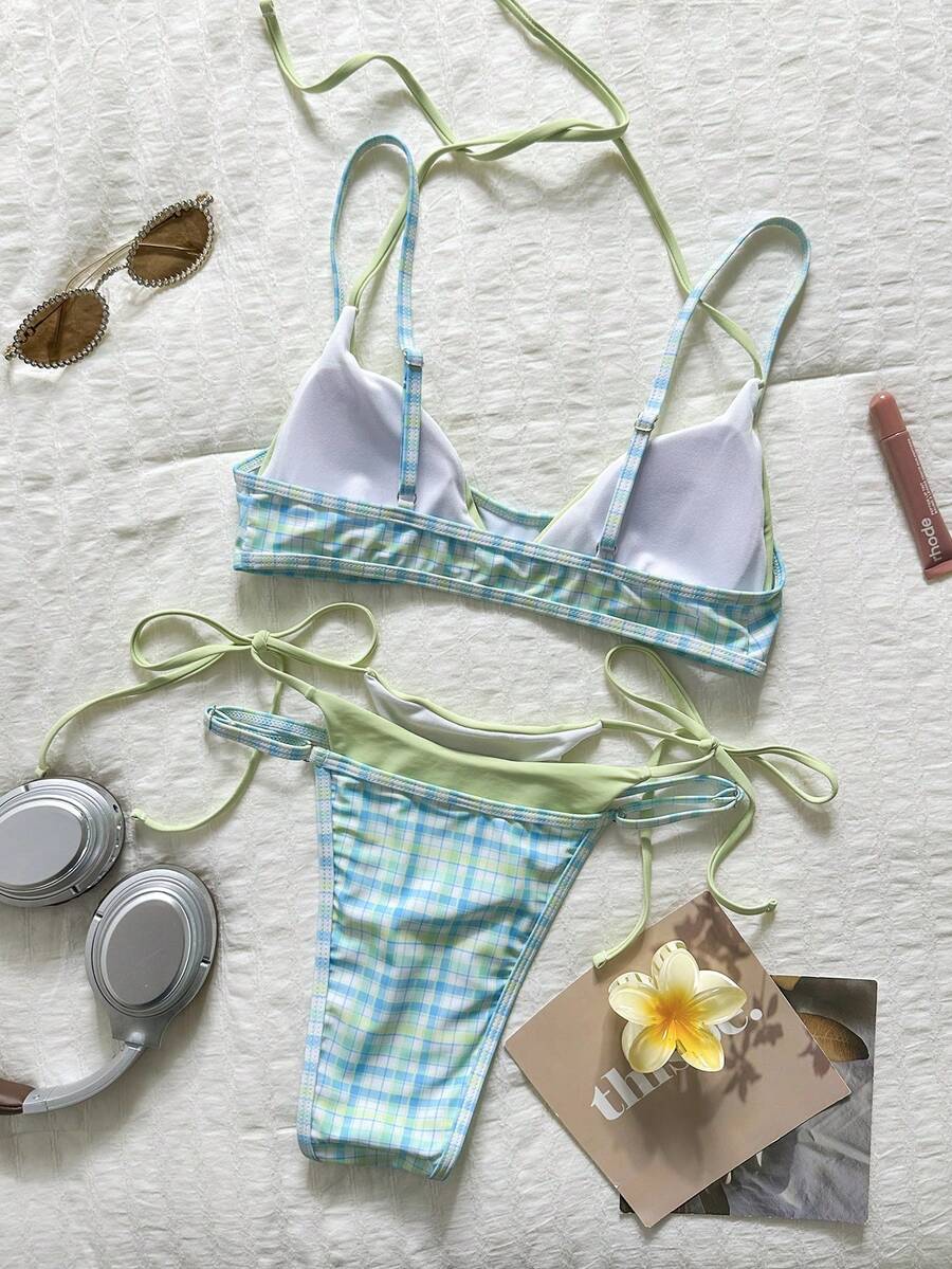 Women's retro polka dot high waist bikini swimsuit set with spaghetti straps and knot tie-back top.