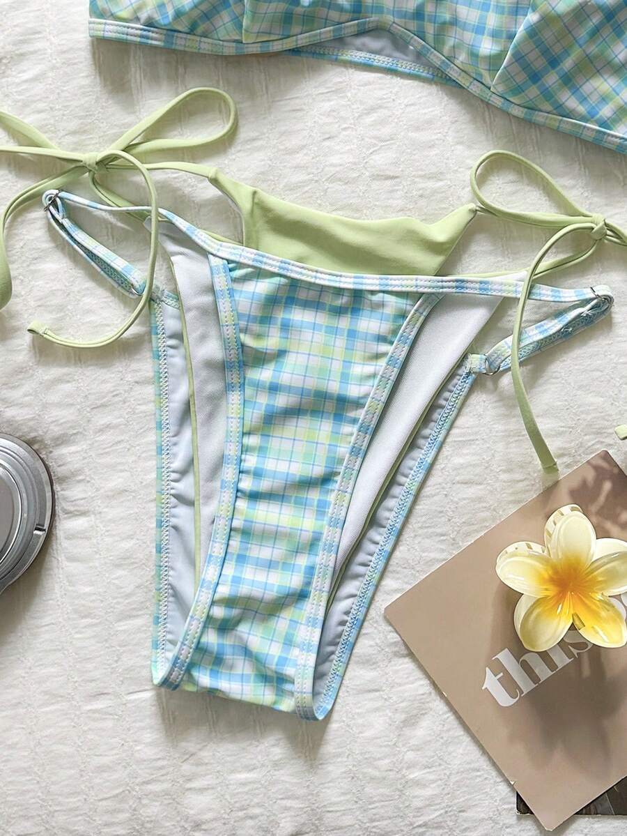 Women's retro polka dot high waist bikini swimsuit set with spaghetti straps and knot tie-back top.