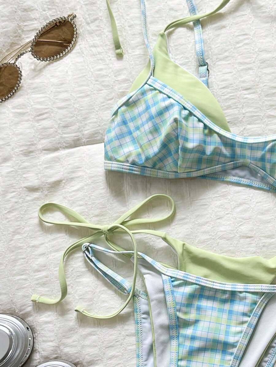 Women's retro polka dot high waist bikini swimsuit set with spaghetti straps and knot tie-back top.