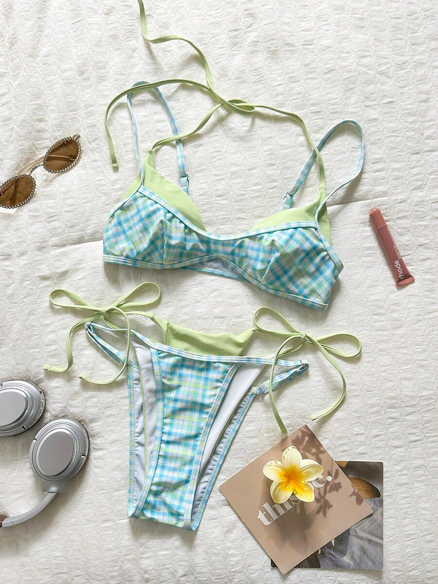 Women's retro polka dot high waist bikini swimsuit set with spaghetti straps and knot tie-back top.