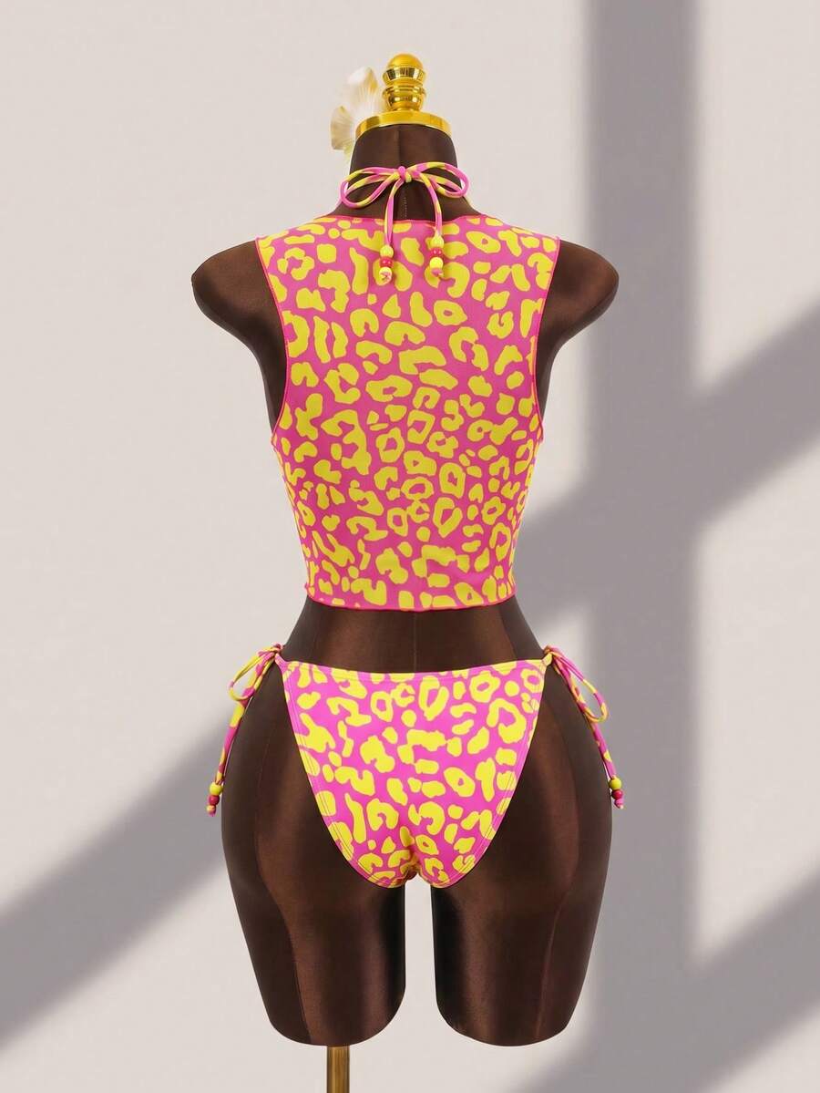 Brown striped 3-piece bikini set for women featuring a halter tie neck, wireless triangle cups with removable padding, cut-out details, and low waist tie side bottoms.