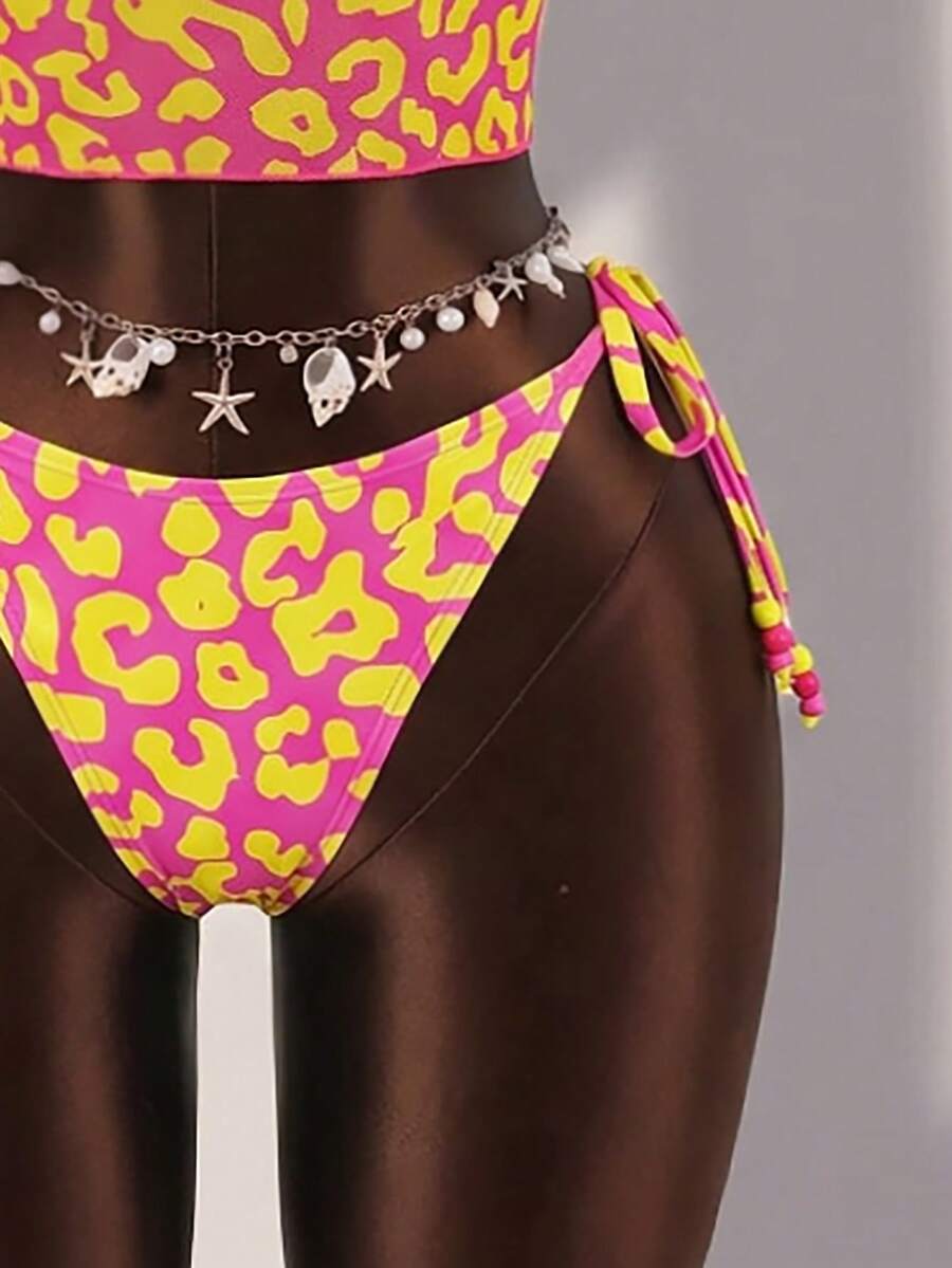 Brown striped 3-piece bikini set for women featuring a halter tie neck, wireless triangle cups with removable padding, cut-out details, and low waist tie side bottoms.