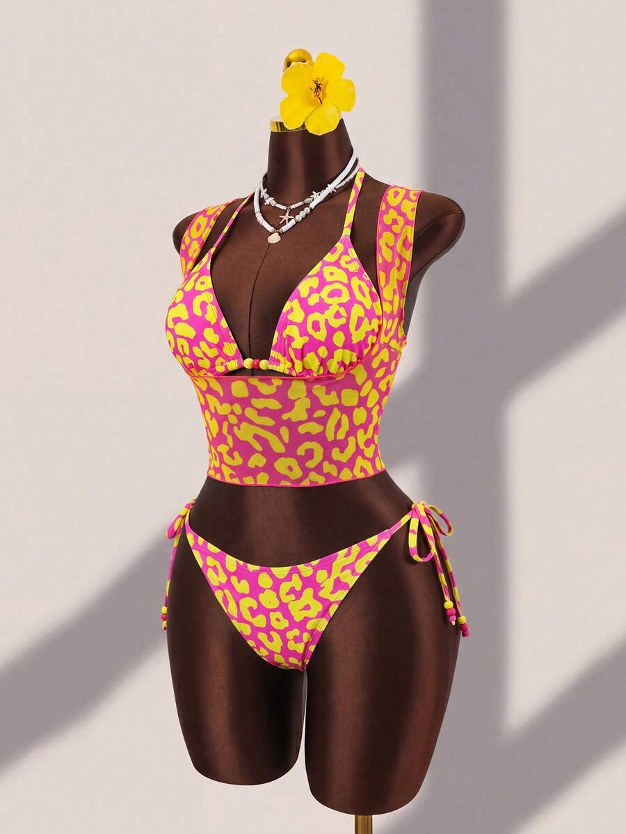 Brown striped 3-piece bikini set for women featuring a halter tie neck, wireless triangle cups with removable padding, cut-out details, and low waist tie side bottoms.