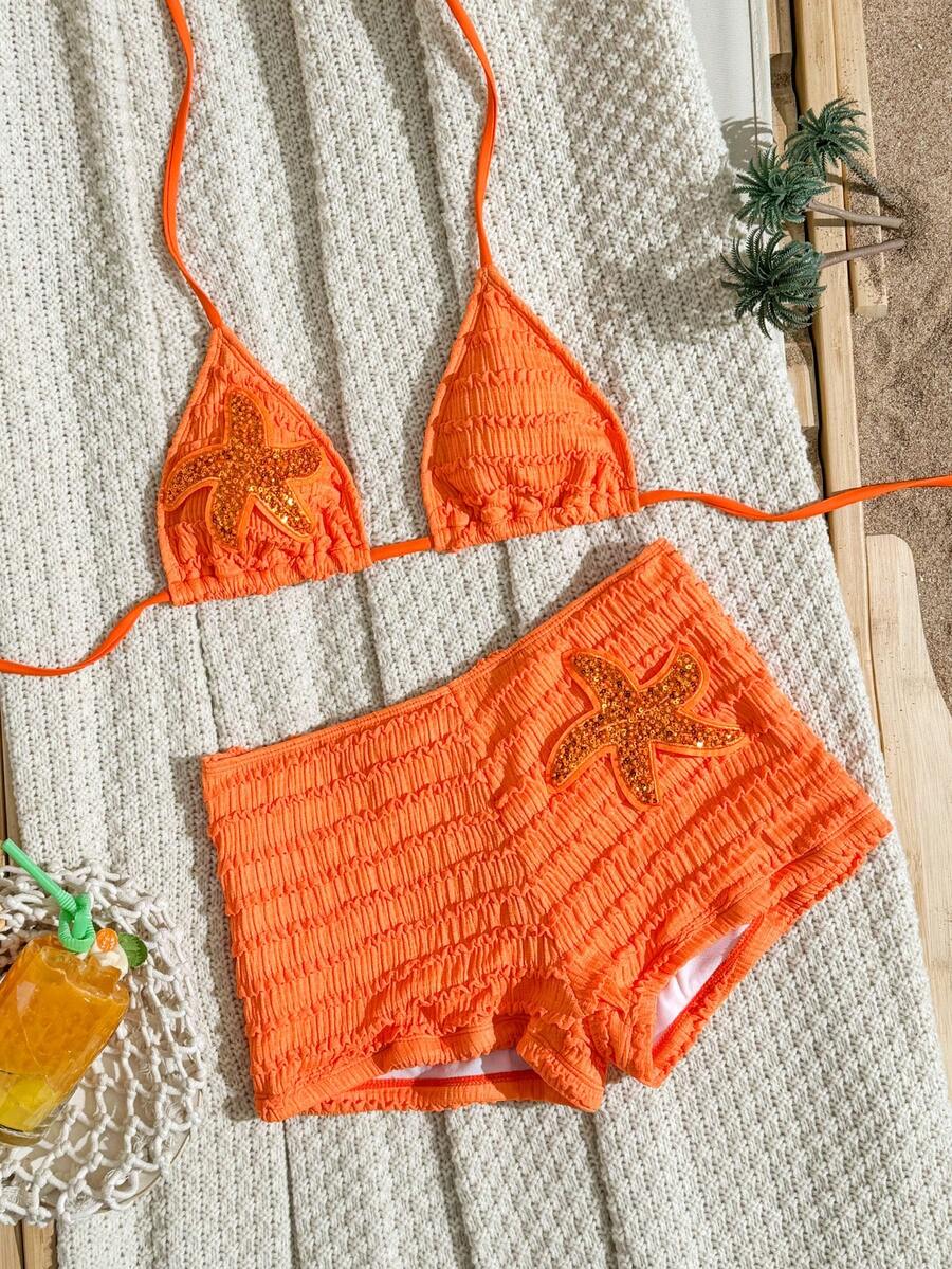 Women's apricot two-piece swimsuit set with a halter tie-back top and matching high stretch shorts.