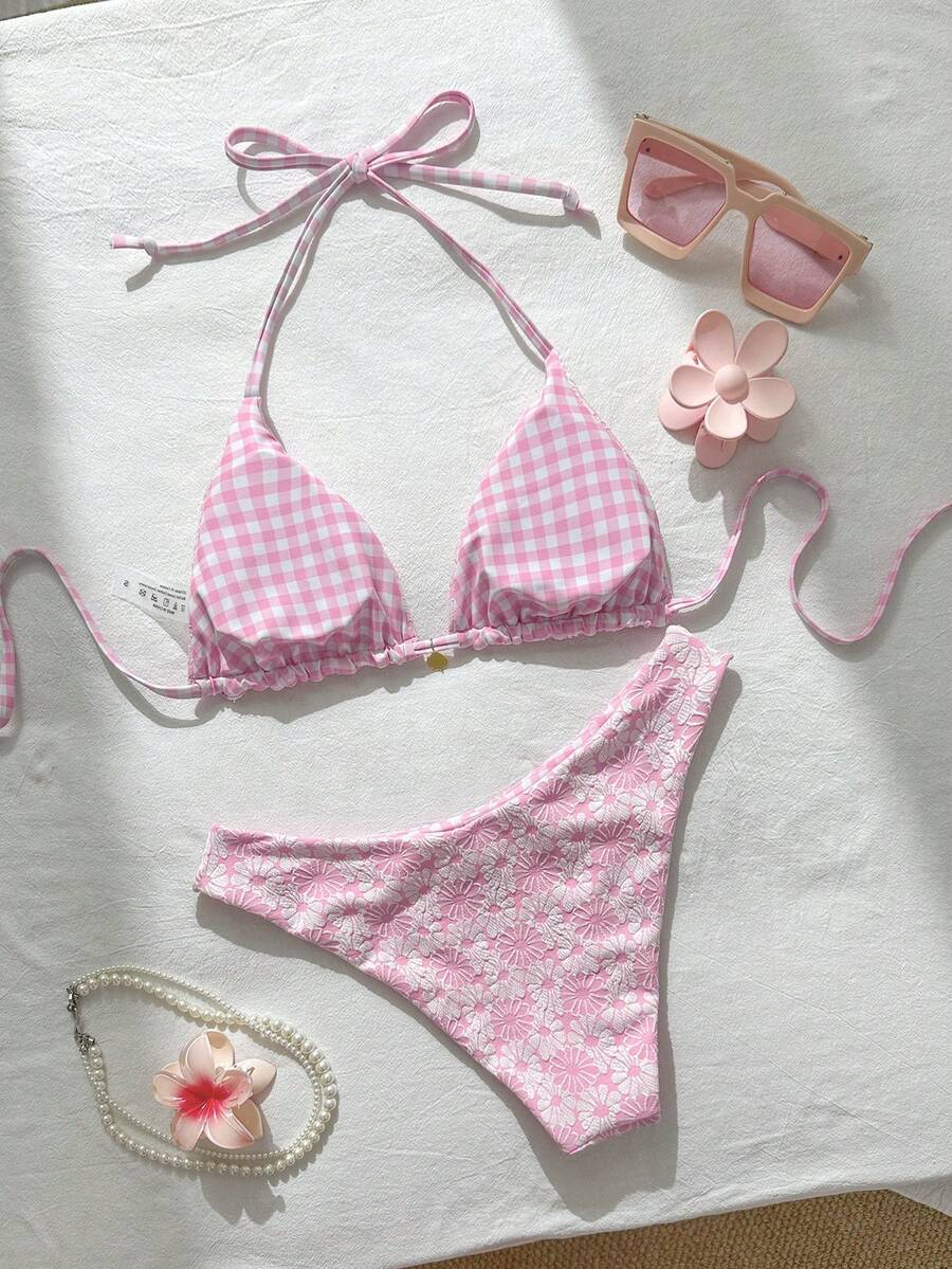 Women's black textured plaid 2-piece bikini set featuring a halter neckline, wireless triangle cups with removable padding, and mid-waist bottoms.
