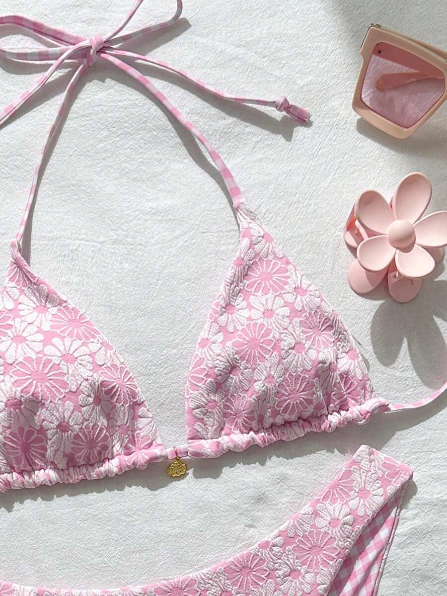 Women's black textured plaid 2-piece bikini set featuring a halter neckline, wireless triangle cups with removable padding, and mid-waist bottoms.