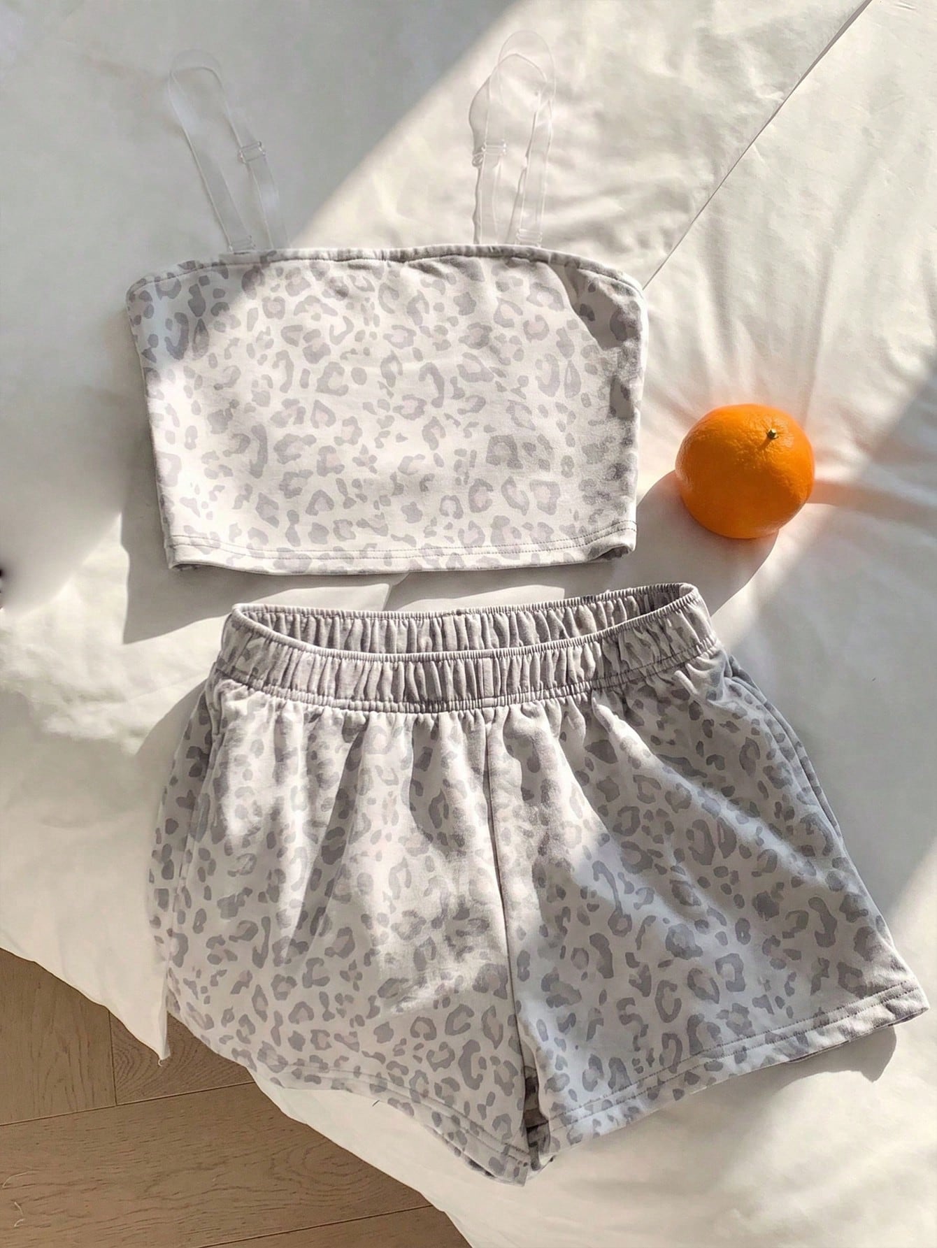Tween girls two-piece summer outfit featuring a brown strapless tube top with contrast pink tape accent and matching brown shorts with pockets.