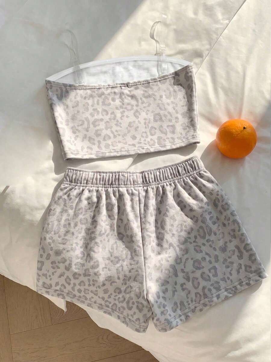 Tween girls two-piece summer outfit featuring a brown strapless tube top with contrast pink tape accent and matching brown shorts with pockets.