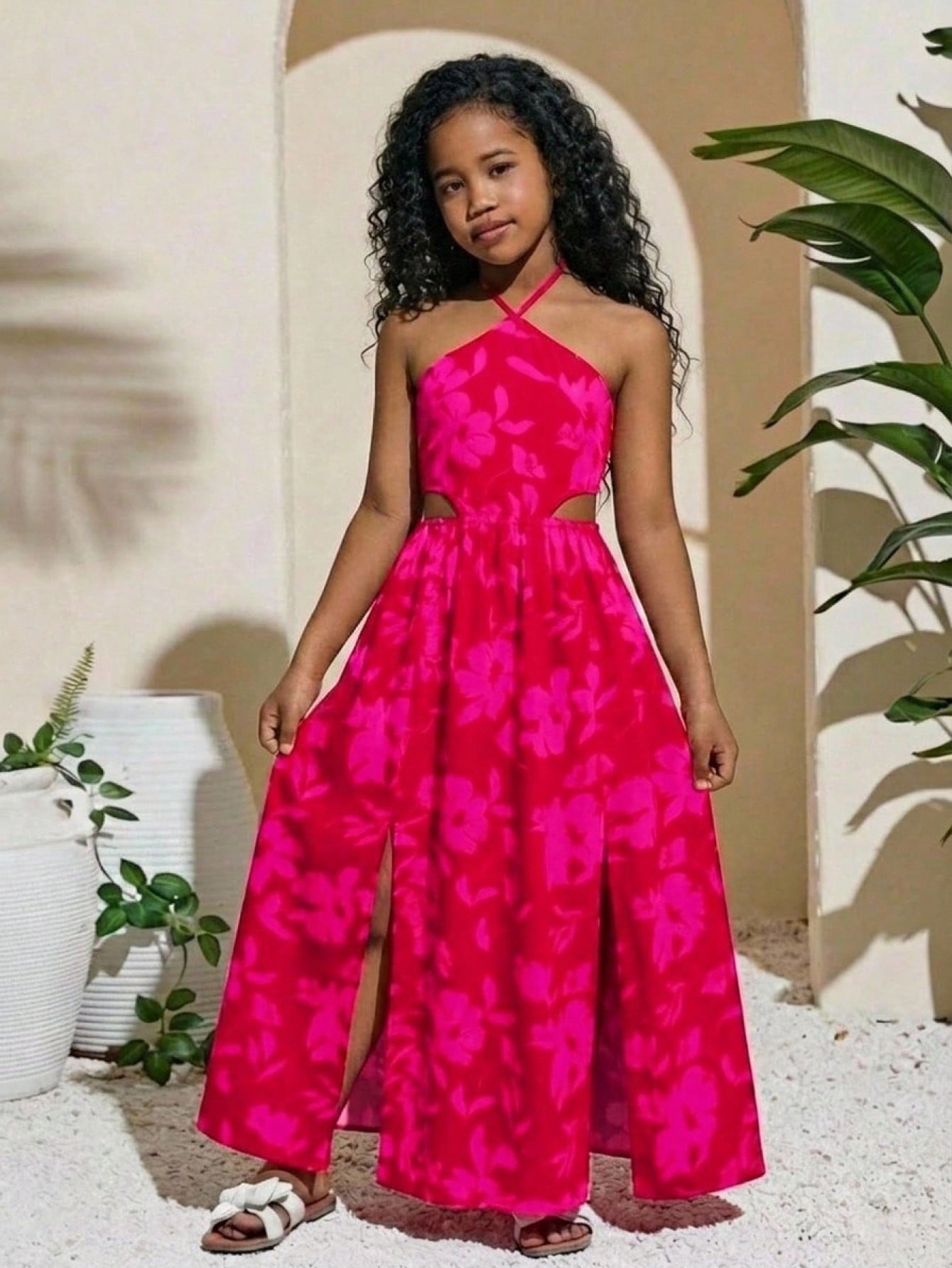 Tween girl yellow long halter dress with cutout waist, split detail, shirred textured fabric, sleeveless design, high waist, and flared hem for beach vacation wear.