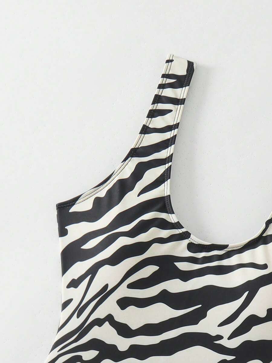 Women's solid color one-piece swimsuit featuring a backless scoop neck design and high cut fit