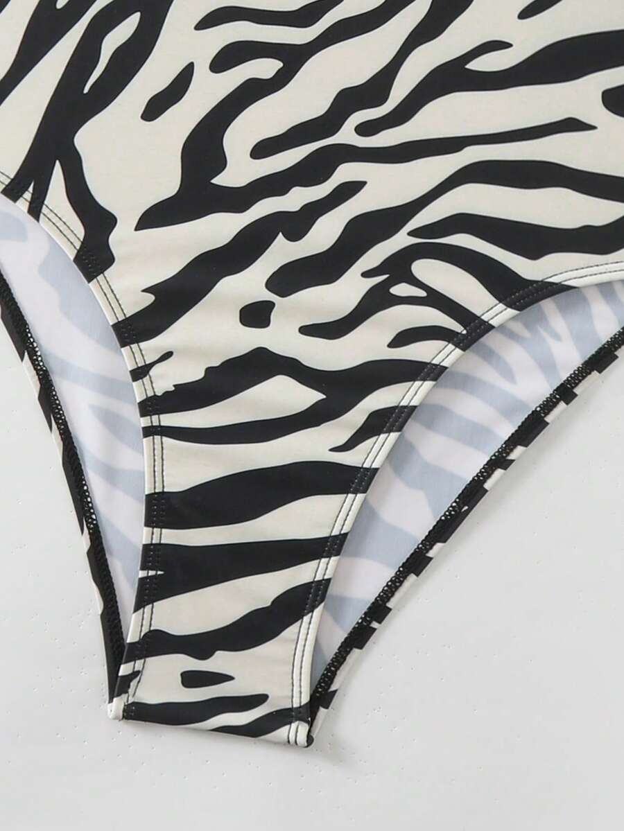 Women's solid color one-piece swimsuit featuring a backless scoop neck design and high cut fit