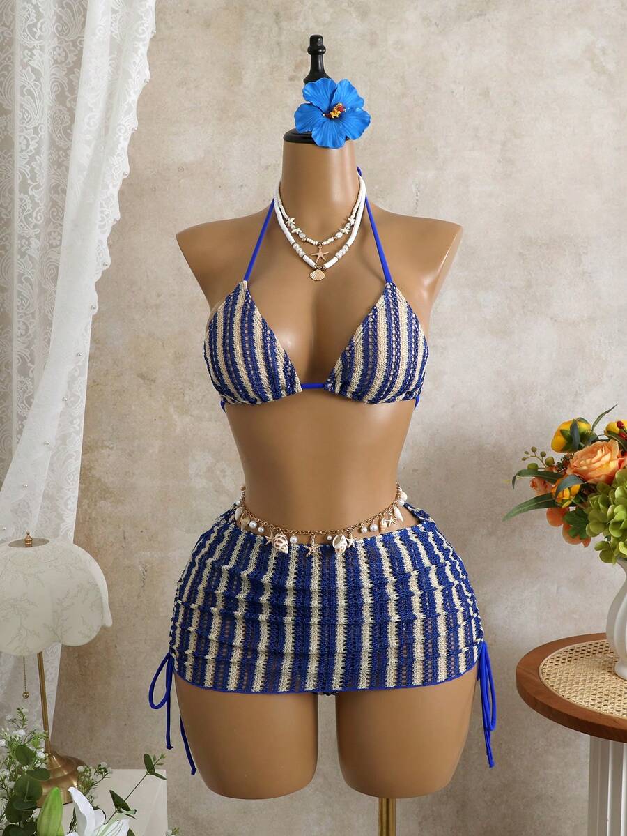 Women's black 3-piece bikini set featuring a halter triangle top with removable padding, high-waisted bottoms, and a knee-length mesh skirt with tie details.