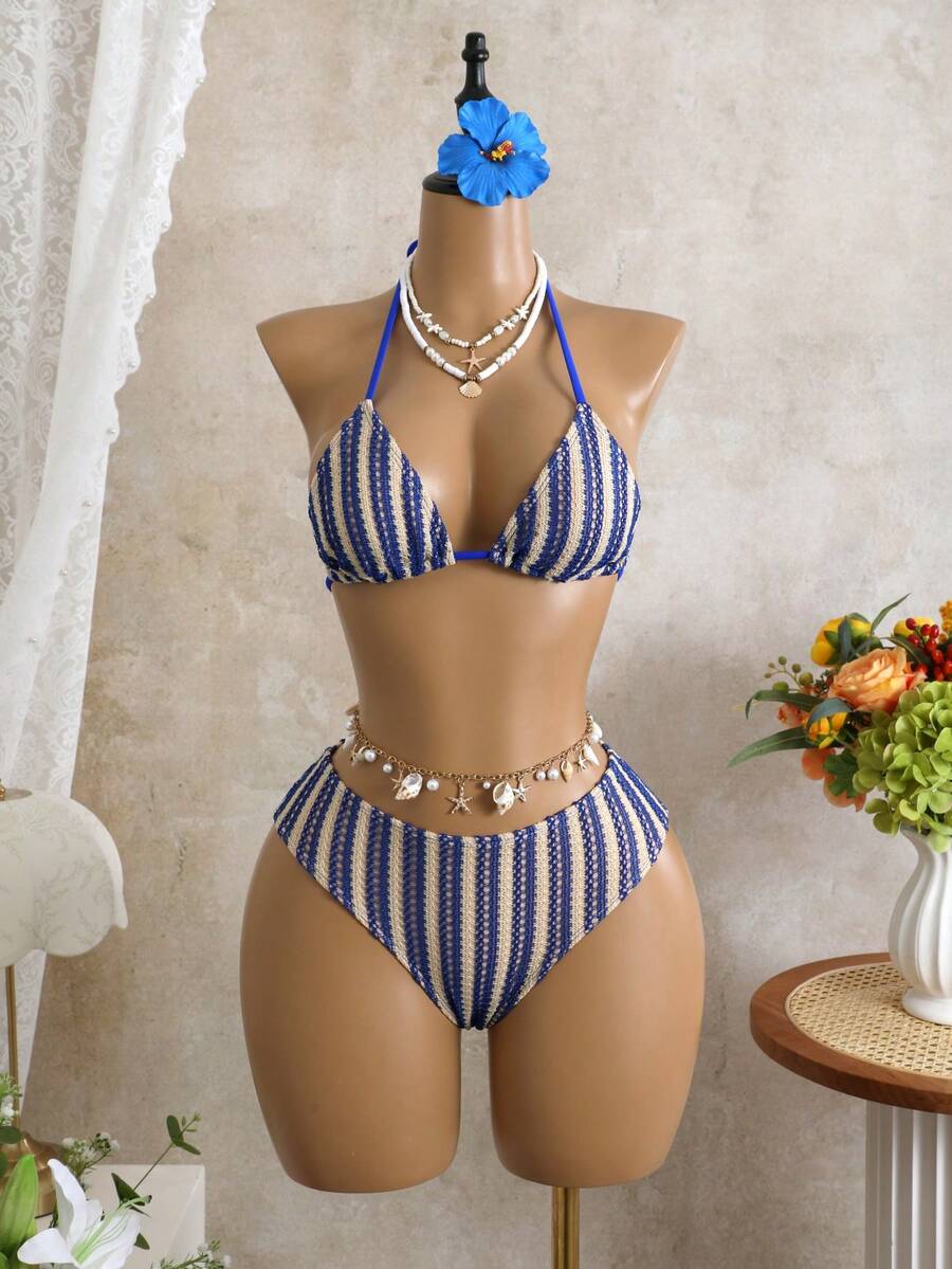 Women's black 3-piece bikini set featuring a halter triangle top with removable padding, high-waisted bottoms, and a knee-length mesh skirt with tie details.