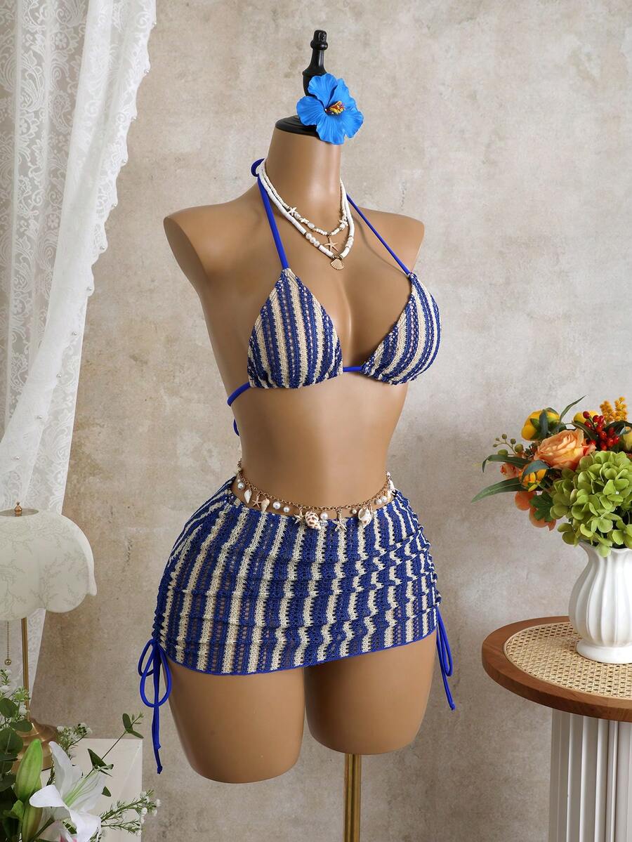 Women's black 3-piece bikini set featuring a halter triangle top with removable padding, high-waisted bottoms, and a knee-length mesh skirt with tie details.