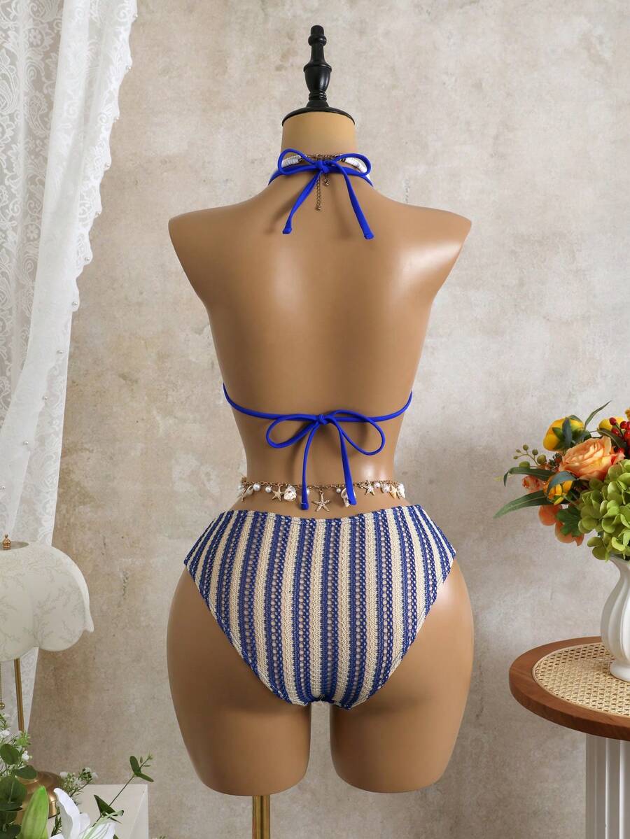 Women's black 3-piece bikini set featuring a halter triangle top with removable padding, high-waisted bottoms, and a knee-length mesh skirt with tie details.