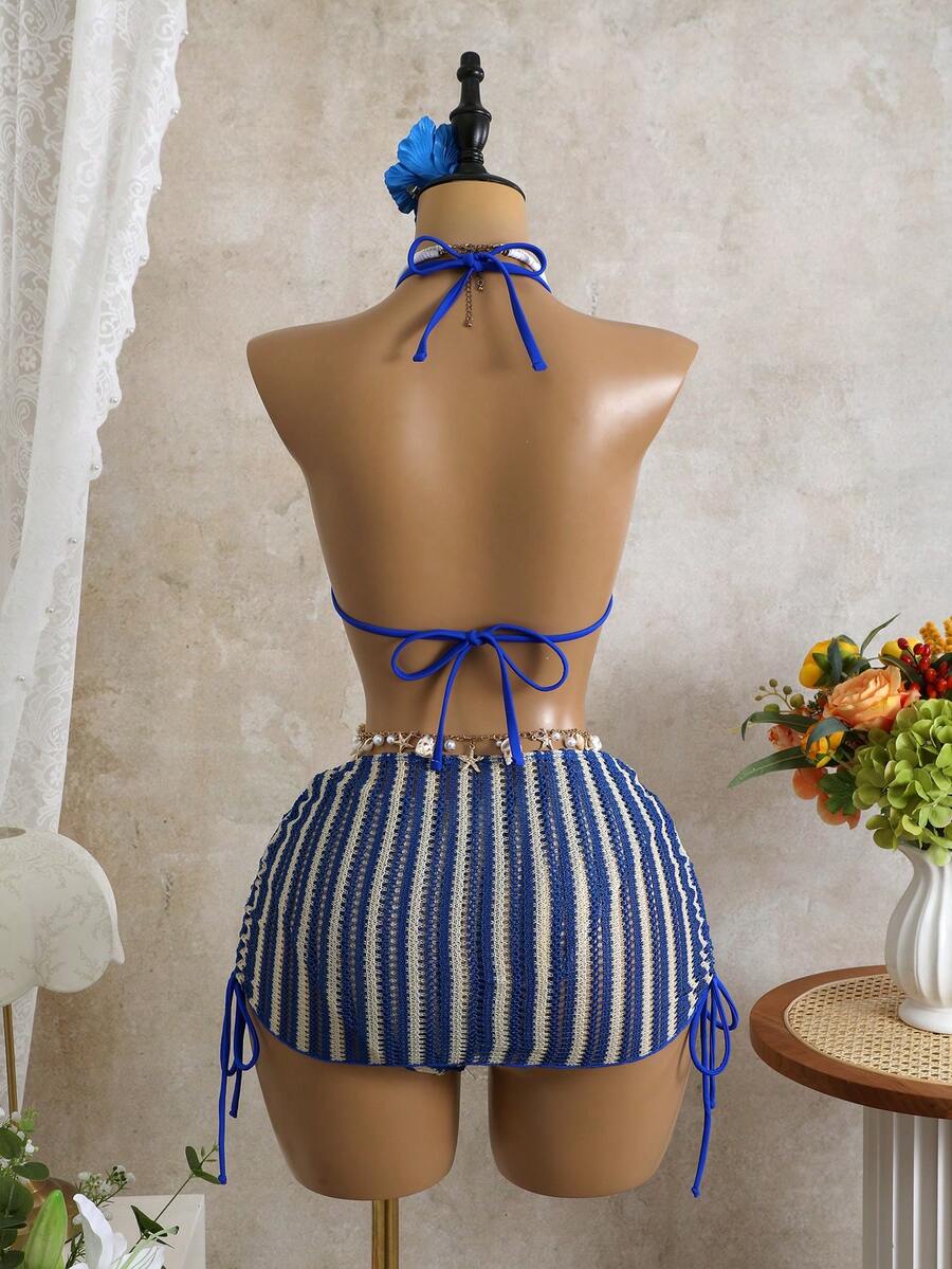 Women's black 3-piece bikini set featuring a halter triangle top with removable padding, high-waisted bottoms, and a knee-length mesh skirt with tie details.