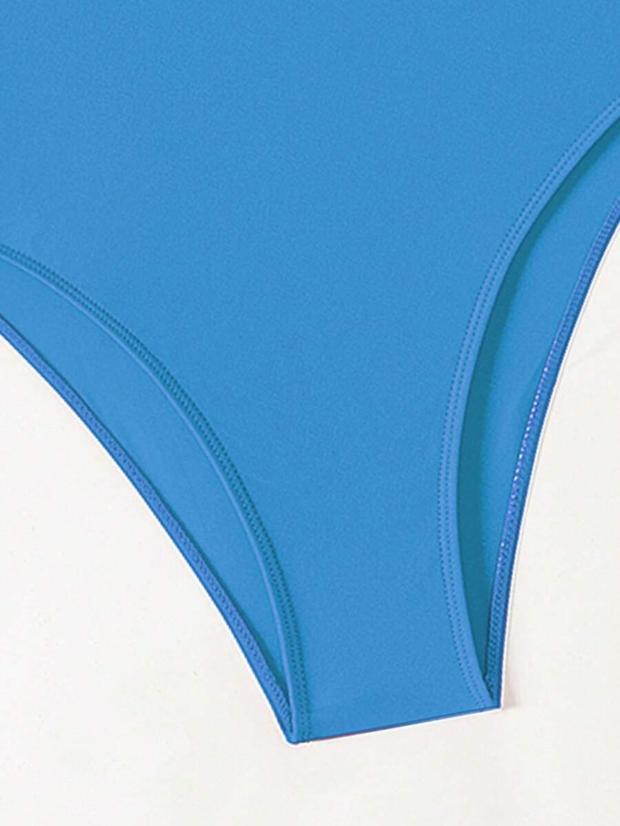 Women's solid color one-piece swimsuit featuring a backless scoop neck design and high cut fit