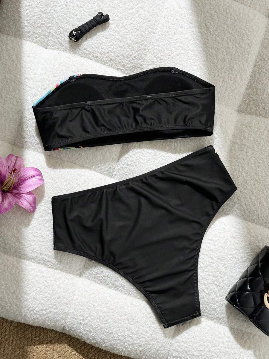 Women's black two-piece bandeau bikini set featuring high waist bottoms, backless buckle closure, and removable padding.