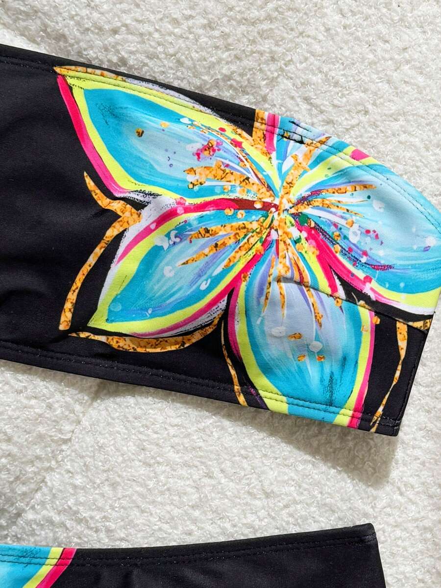 Women's black two-piece bandeau bikini set featuring high waist bottoms, backless buckle closure, and removable padding.