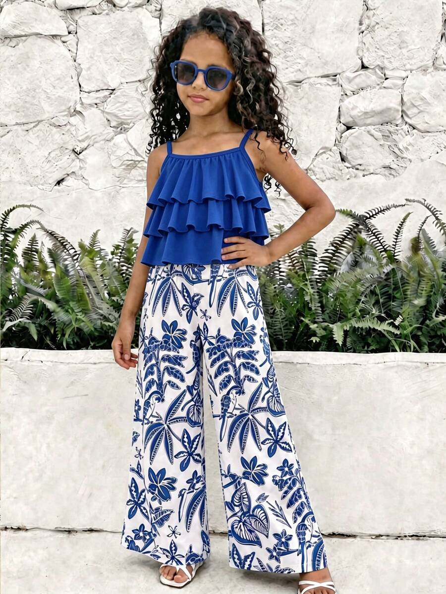 Tween girls blue 2-piece vacation outfit set featuring a tiered ruffle spaghetti strap camisole and loose high-waist pants.