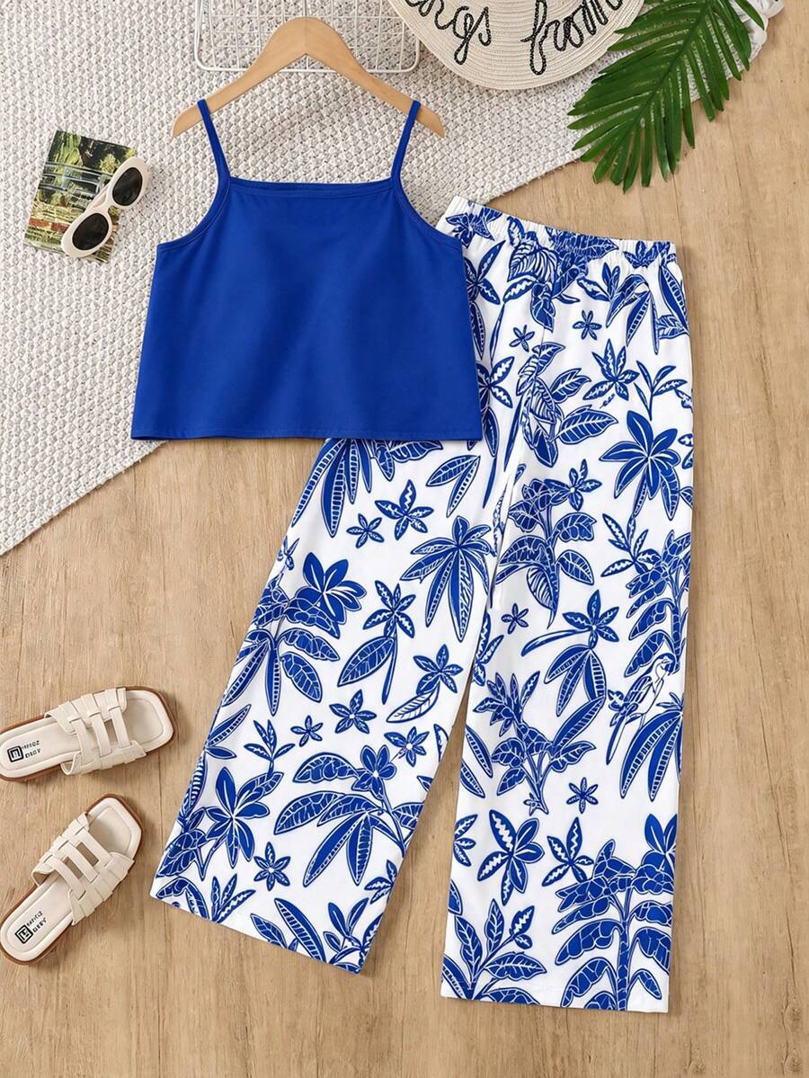 Tween girls blue 2-piece vacation outfit set featuring a tiered ruffle spaghetti strap camisole and loose high-waist pants.