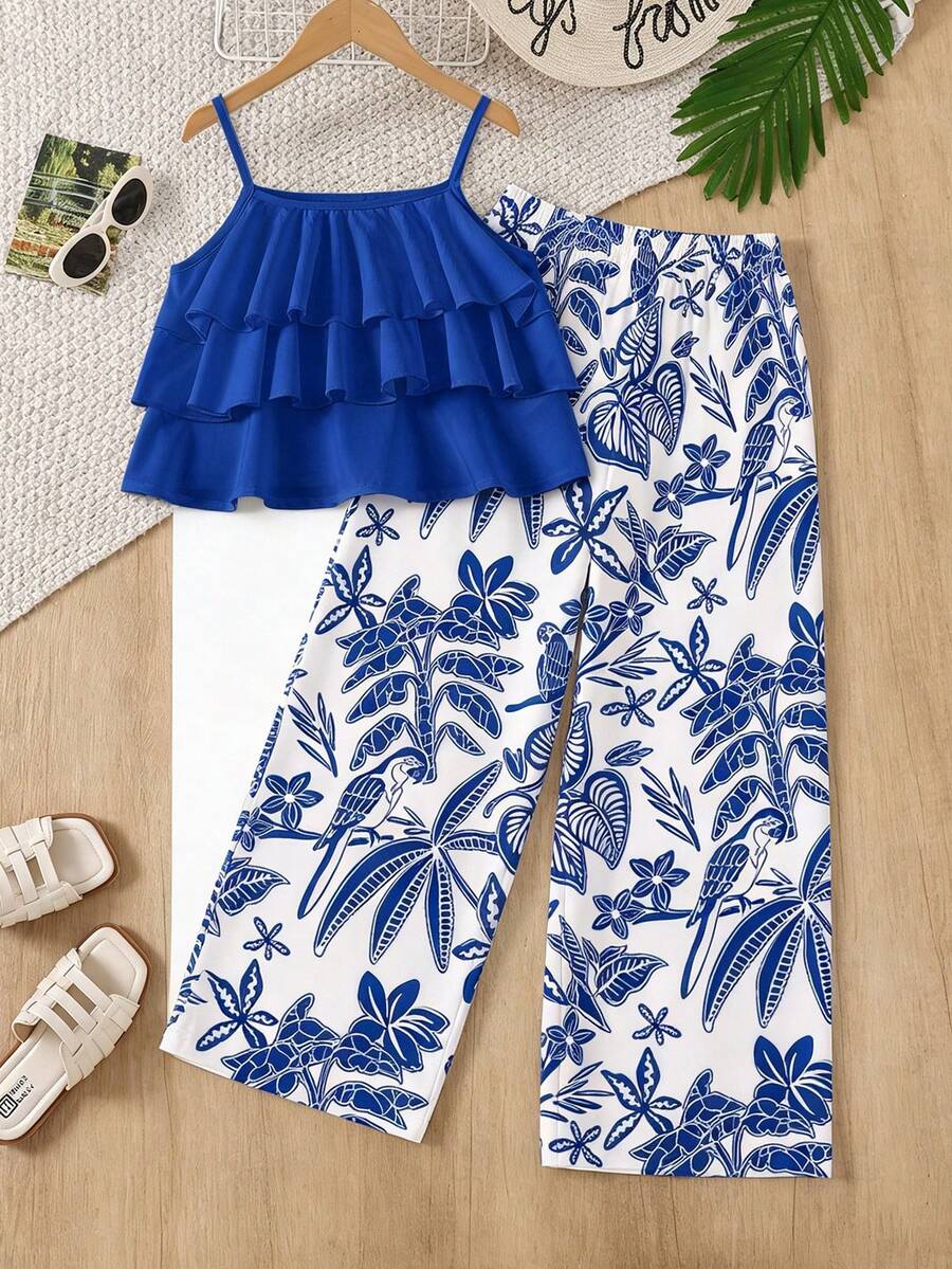 Tween girls blue 2-piece vacation outfit set featuring a tiered ruffle spaghetti strap camisole and loose high-waist pants.