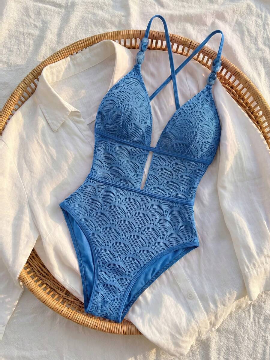 Women's fresh green boho one-piece swimsuit featuring a lace-up V-neckline, textured stretch fabric, and sleeveless design for beach and vacation wear.