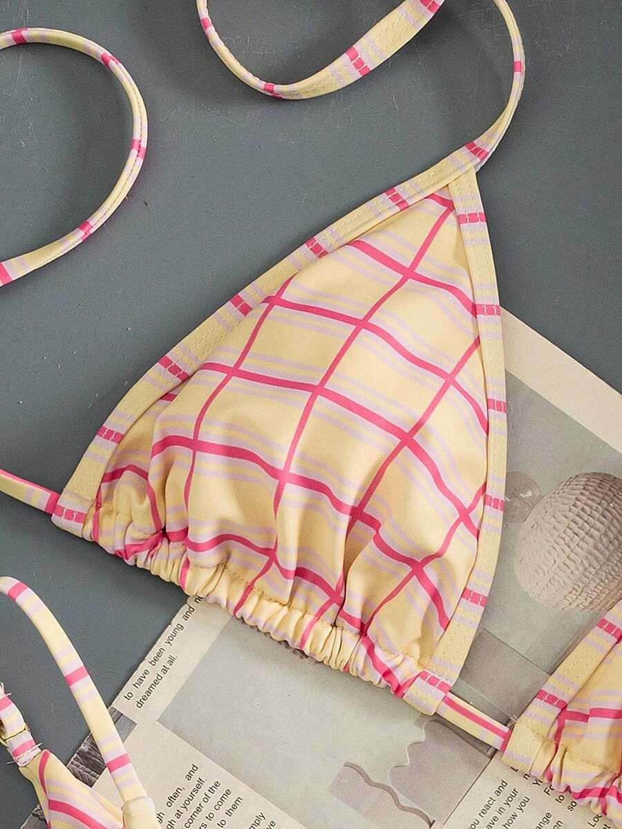 Multicolor bohemian bikini set for women featuring a backless halter top with knot details and high cut swimsuit bottoms.