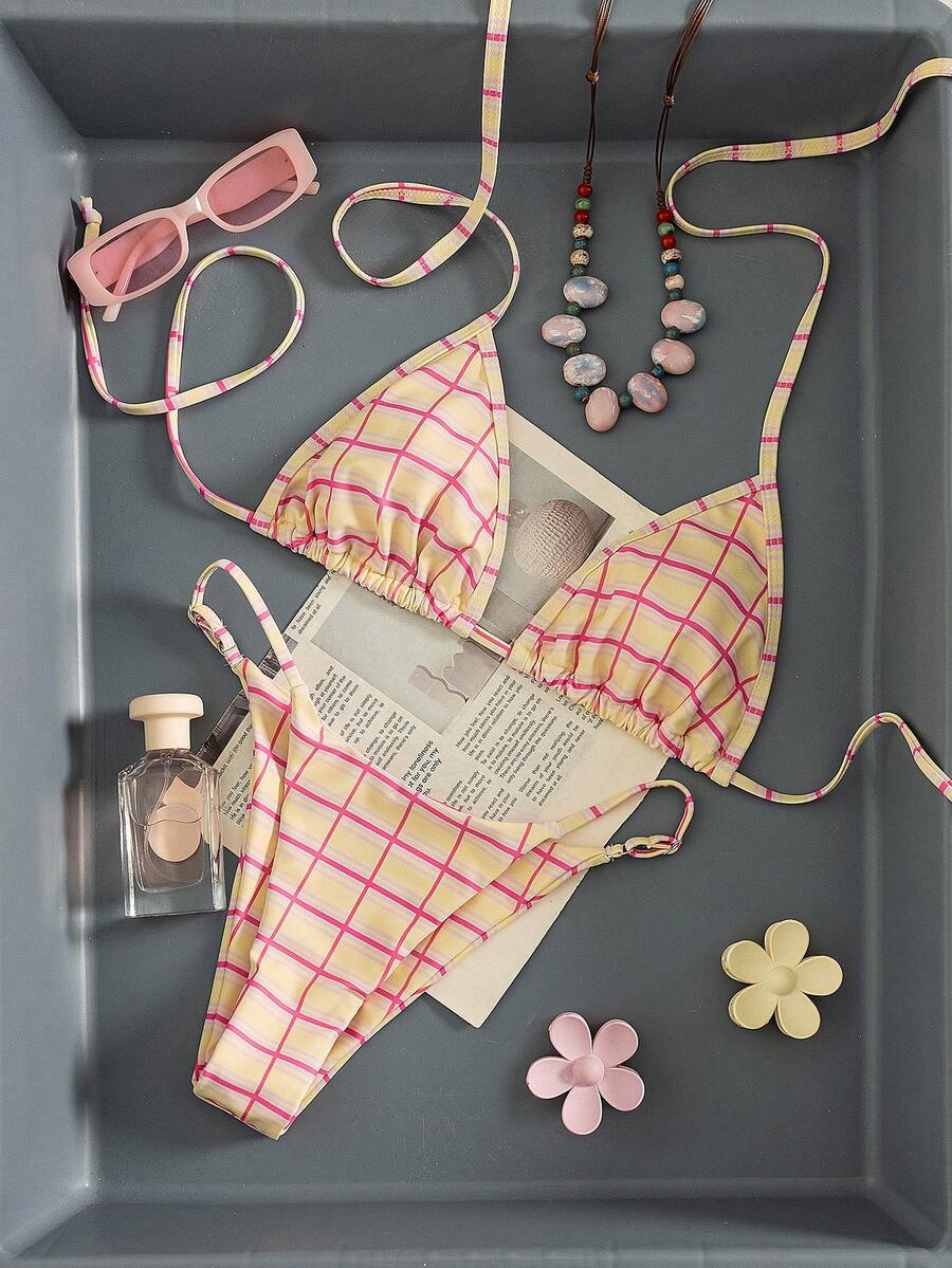Multicolor bohemian bikini set for women featuring a backless halter top with knot details and high cut swimsuit bottoms.
