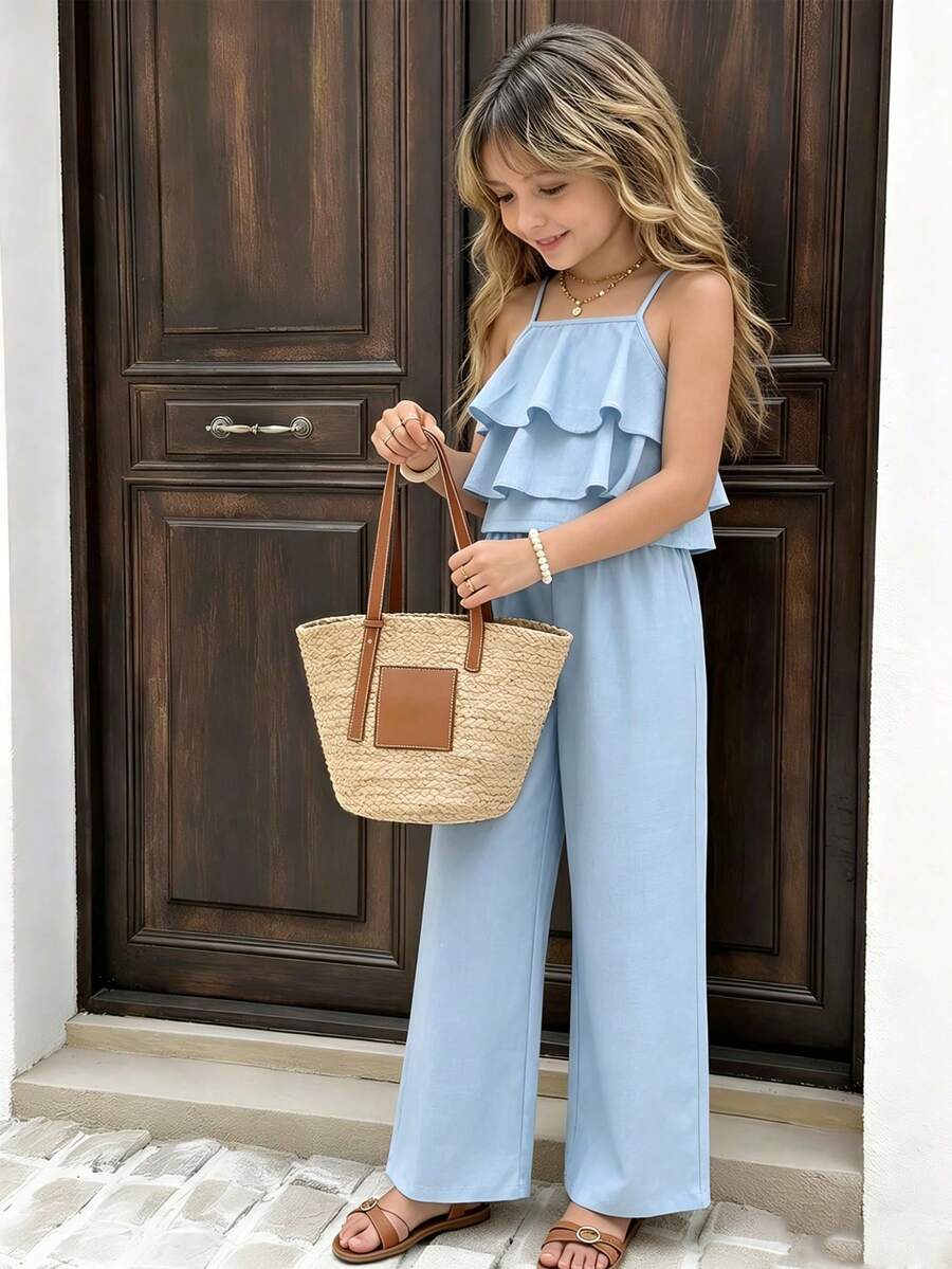 Tween girls blue 2-piece vacation outfit set featuring a tiered ruffle spaghetti strap camisole and loose high-waist pants.