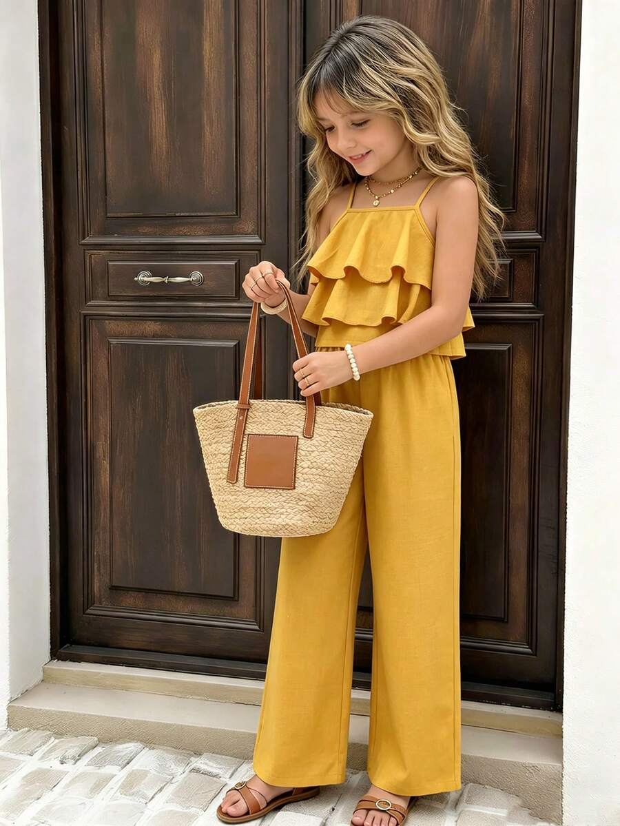 Tween girls blue 2-piece vacation outfit set featuring a tiered ruffle spaghetti strap camisole and loose high-waist pants.