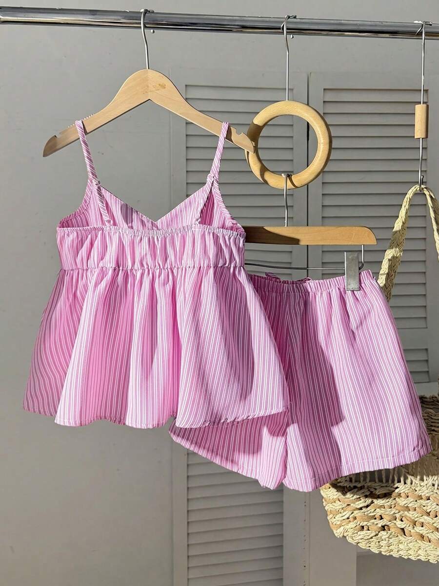 Tween girl 2-piece summer set with a black and white sleeveless striped spaghetti strap tank top with ruffle details and matching casual shorts.