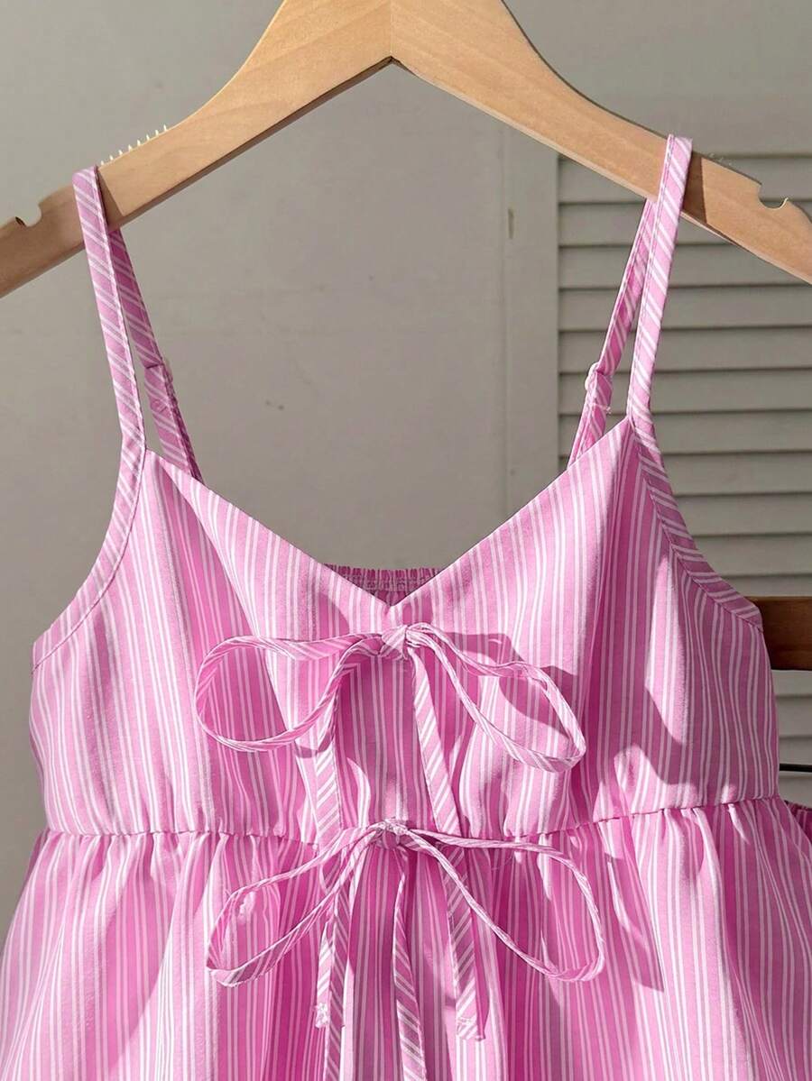 Tween girl 2-piece summer set with a black and white sleeveless striped spaghetti strap tank top with ruffle details and matching casual shorts.
