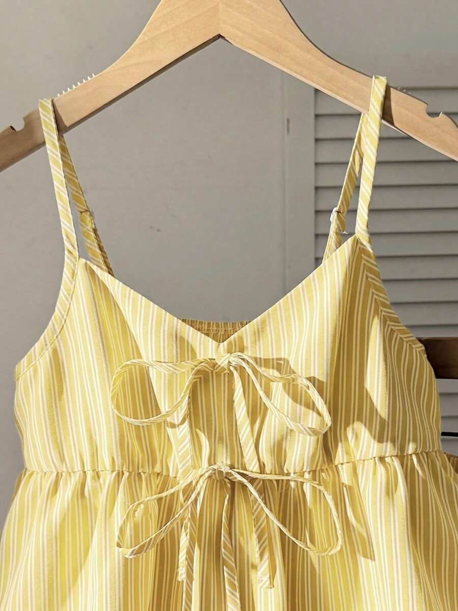 Tween girl 2-piece summer set with a black and white sleeveless striped spaghetti strap tank top with ruffle details and matching casual shorts.