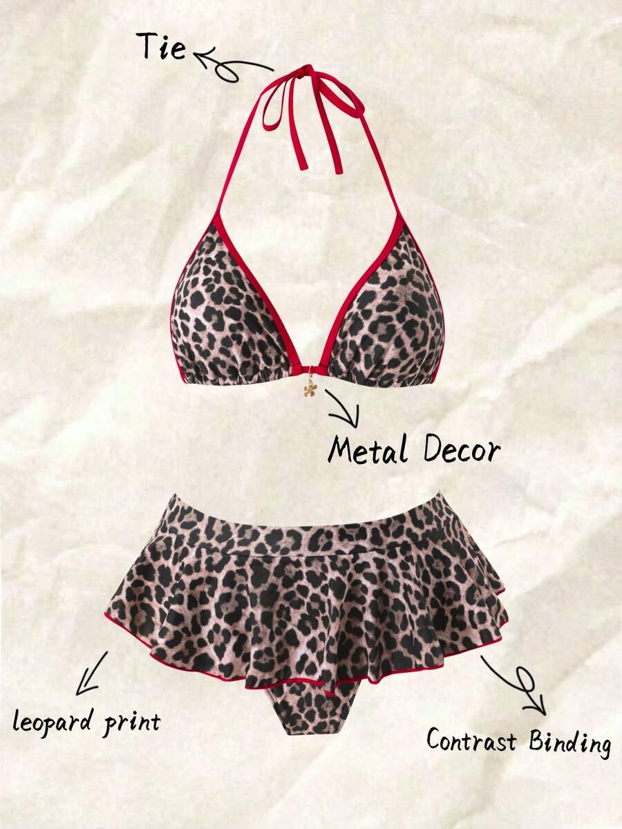 Women's 70s retro black and white polka dot bikini set featuring a halter triangle top and ultra low waist bottoms.