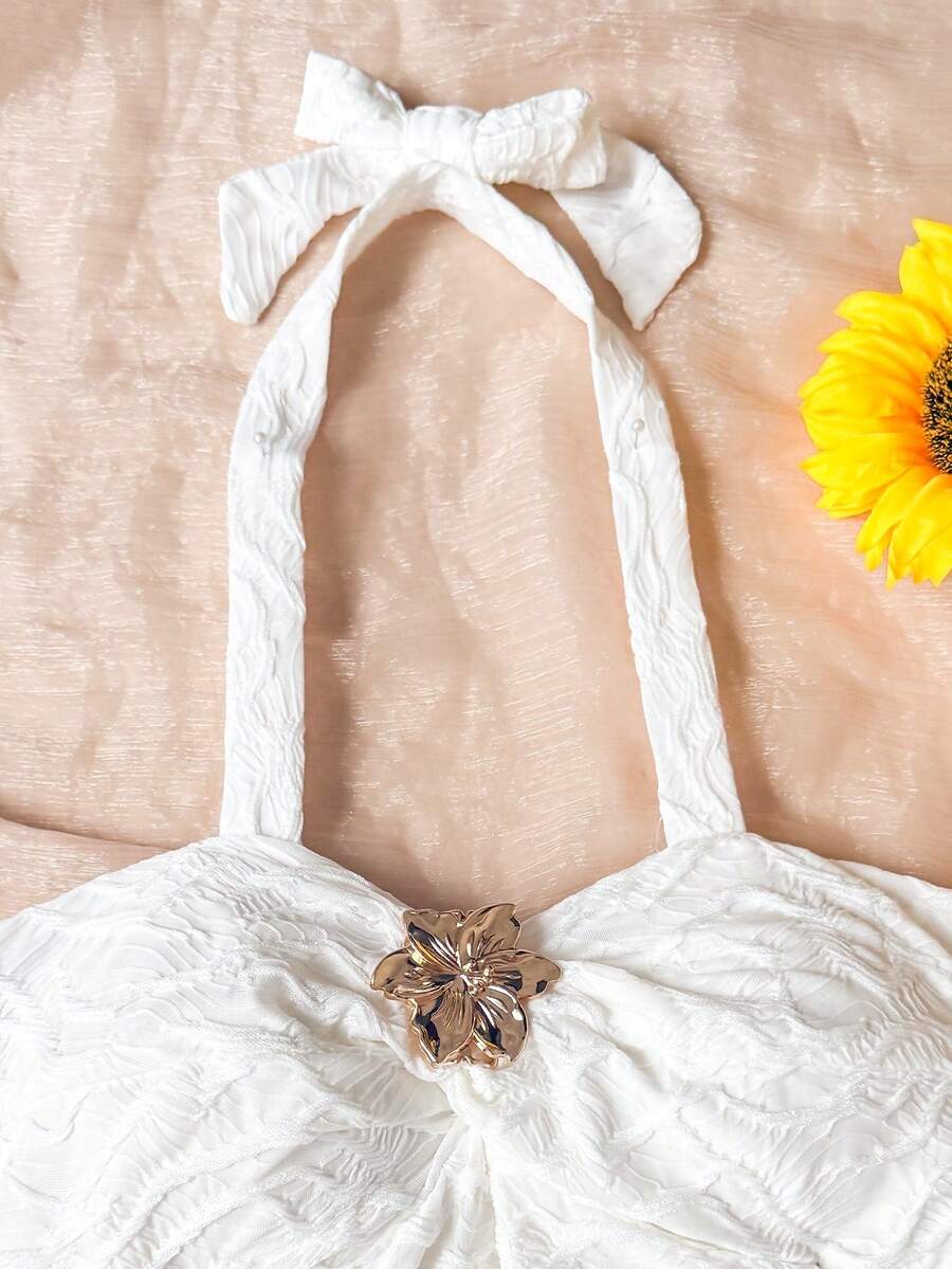Tween girls blue and white floral halter sundress with shirred detail, sleeveless cami style, high waist, and tiered ruffle hem for vacation wear